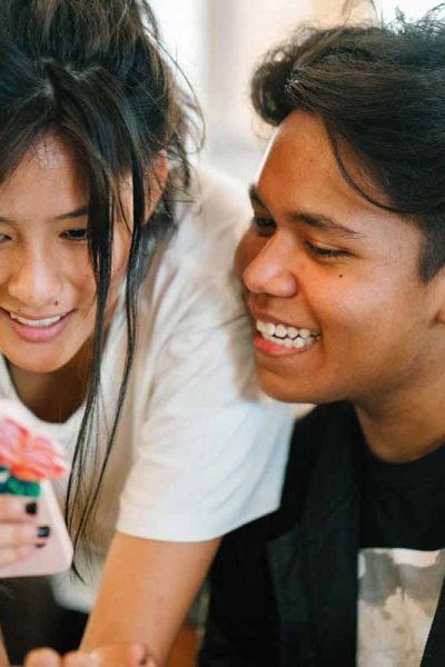 woman-standing-near-man-while-carrying-smartphone-1186886-web